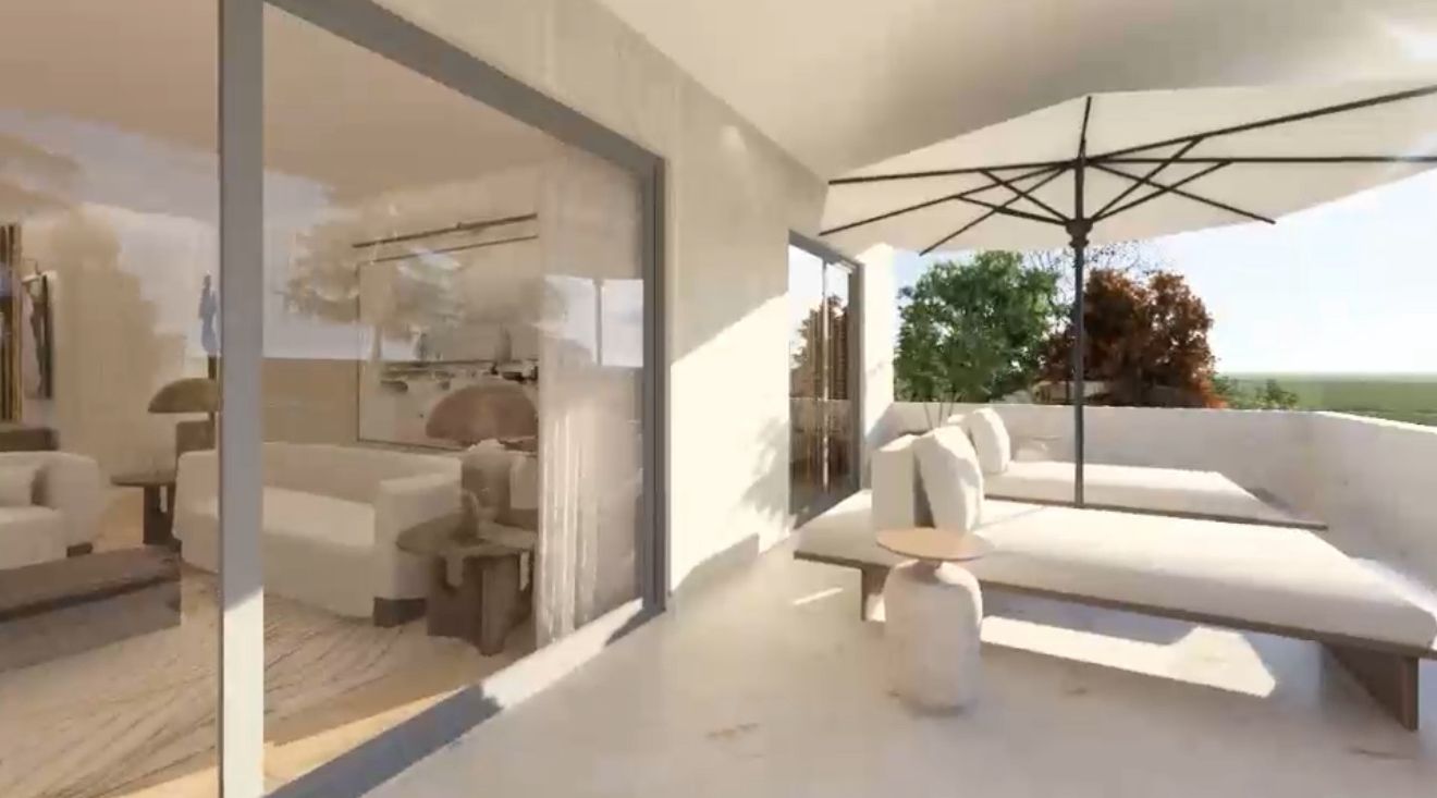 Shaded veranda lounge with sun beds and parasol