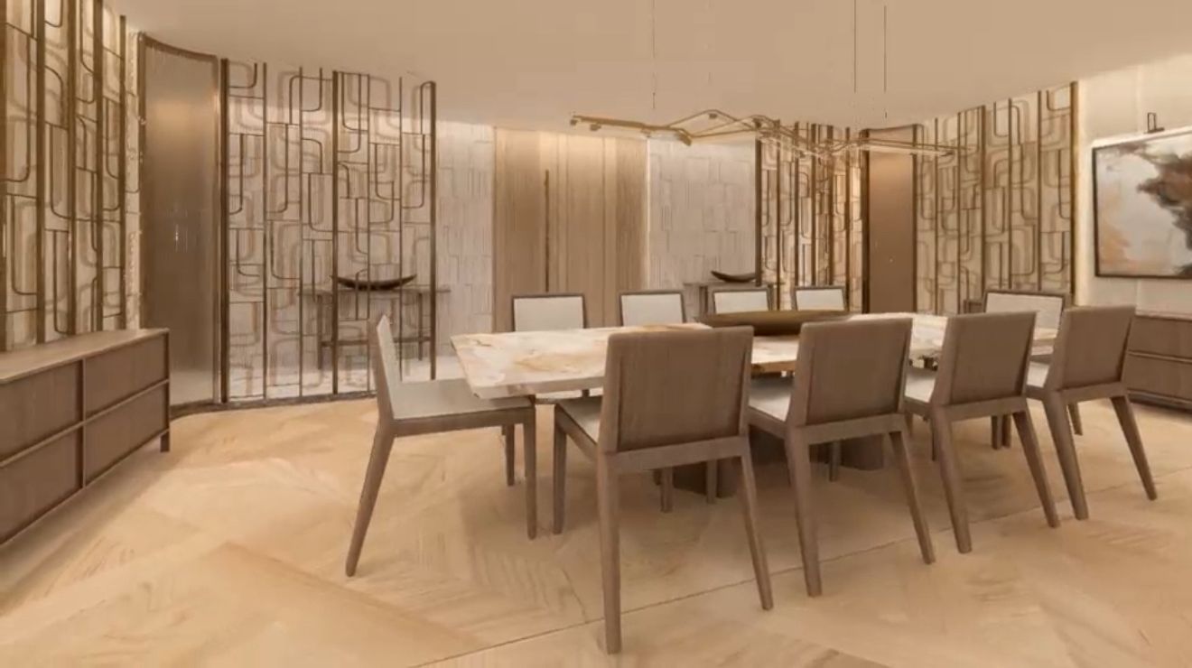 Formal dining room framed by bronze decorative screens