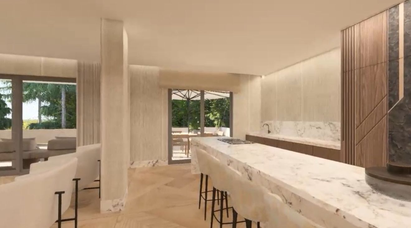 Marble kitchen island with bar seating and terrace access
